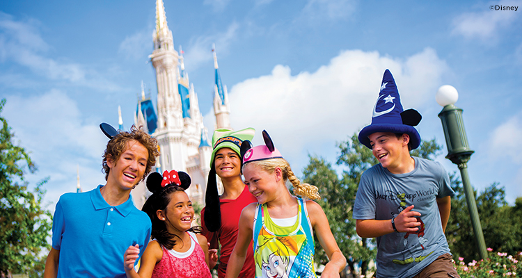 A family outside Cinderella's Castle in Walt Disney World in Florida