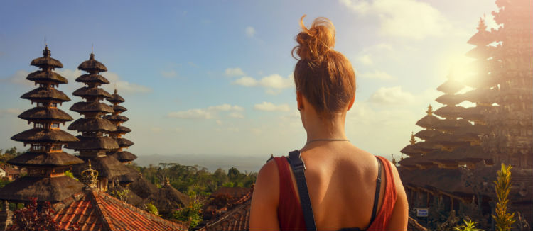 Girl overlooking Bali temples