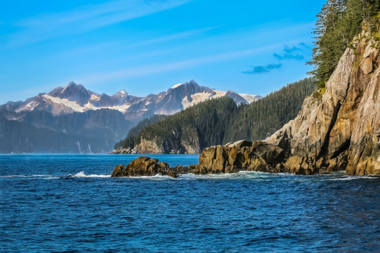 The rocky coastline of Alaska during the day