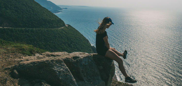 A girl overlooking the Cabot Trail in Nova Scotia