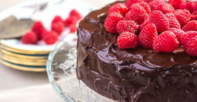 A chocolate cake on a glass plate