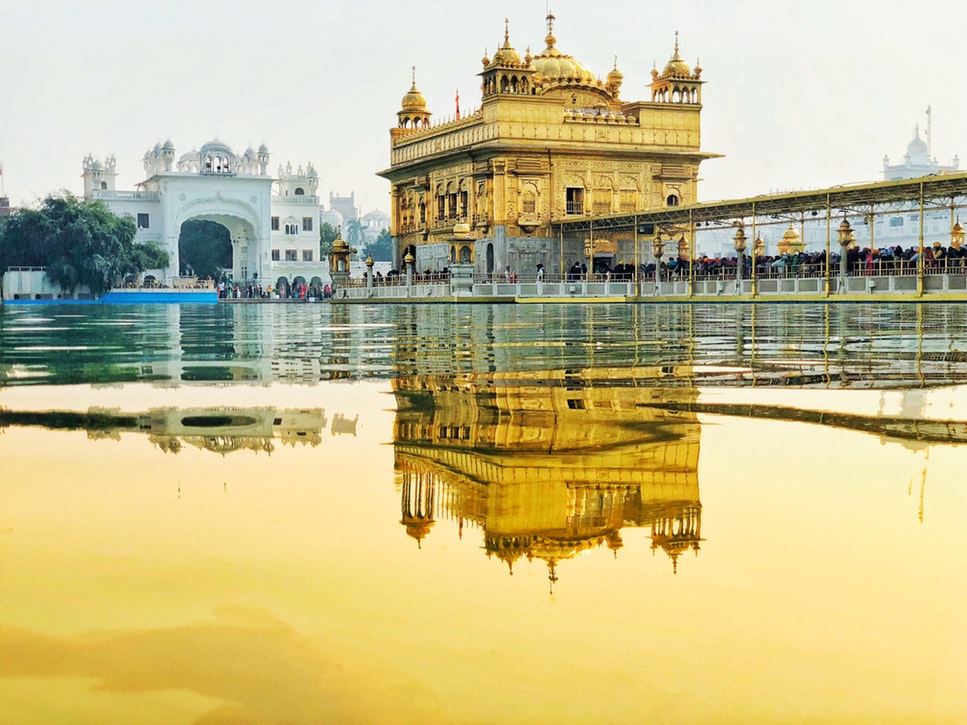 Traditional temple buildings in India beside a river