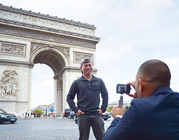 A man having his picture taken in Paris. 
