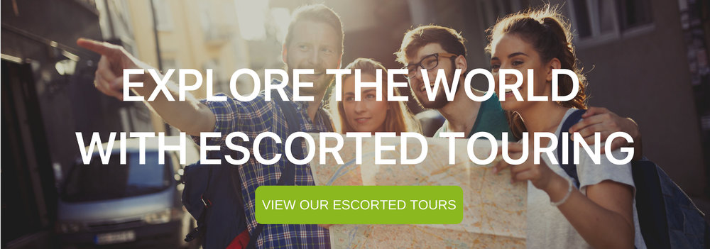 A banner that says "Explore the world with Escorted Touring" with a group of tourists looking at map. 