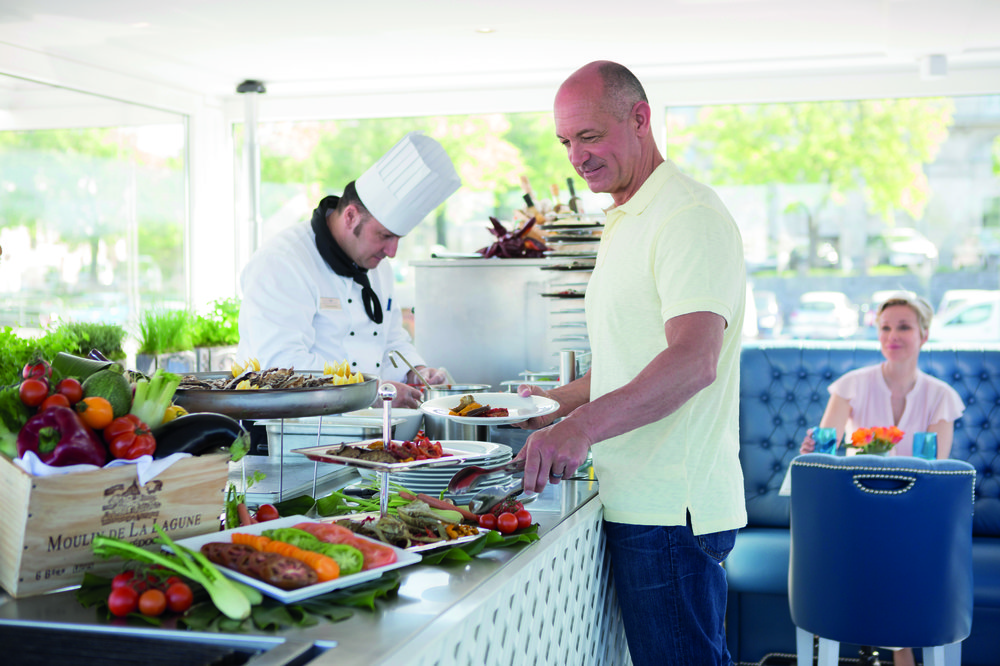 A man at the breakfast buffet on-board a river cruise
