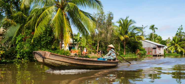 A traditional Vietnamese boat sailing the Mekong river. 