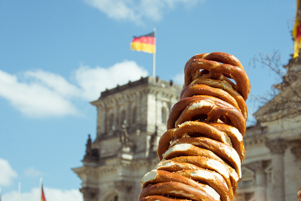 A picture of a pile of pretzels in front of a German flag